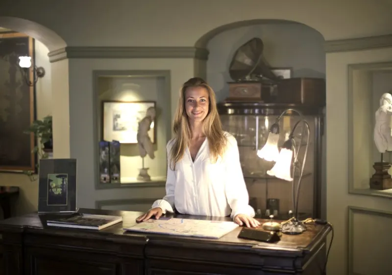 A hotel concierge at a warm front desk